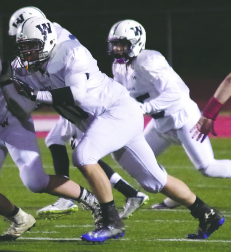 Warren's Hayden Salapek (70) turned in a stellar season on the defensive side of the ball, earning first team Region 5 honors along the defensive line for the Dragons.